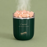 Green Crystal salt diffuser with lettering on a pastel background