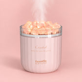 Pink Crystal salt diffuser with mist on a pastel background